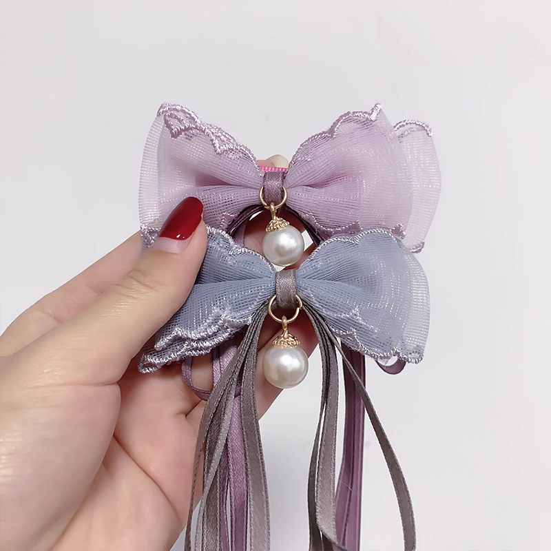 Children's Super Fairy Pearl Bow Headwear Baby Ponytail Streamer Braided Hair Clip Summer Tie Hair Headwear Wholesale Application Scenario