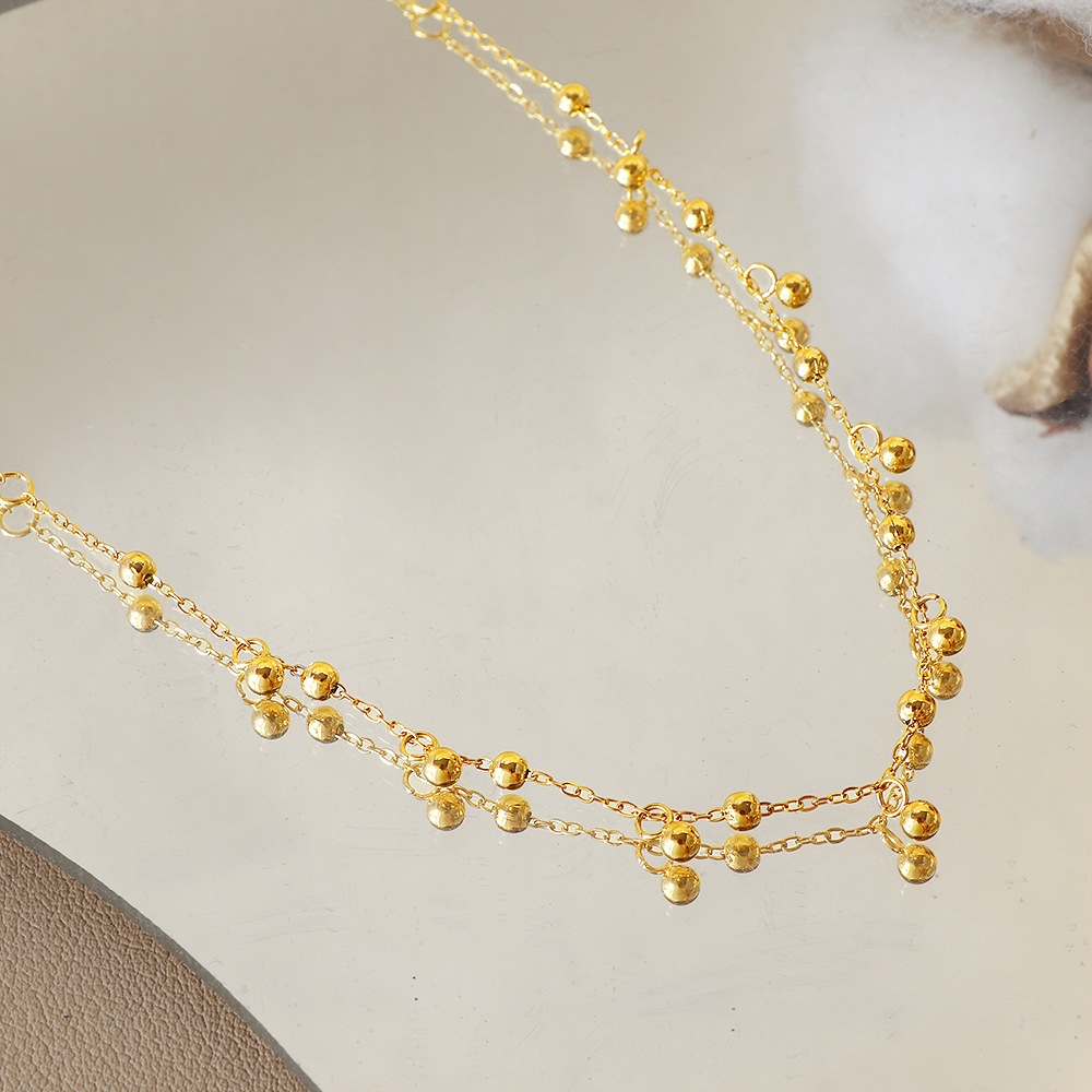 A popular 18K gold bean-shaped tassel necklace in Europe and America, featuring a minimalist and high-end look, is a versatile titanium steel collarbone necklace that goes well with a cold style on Instagram Specification image