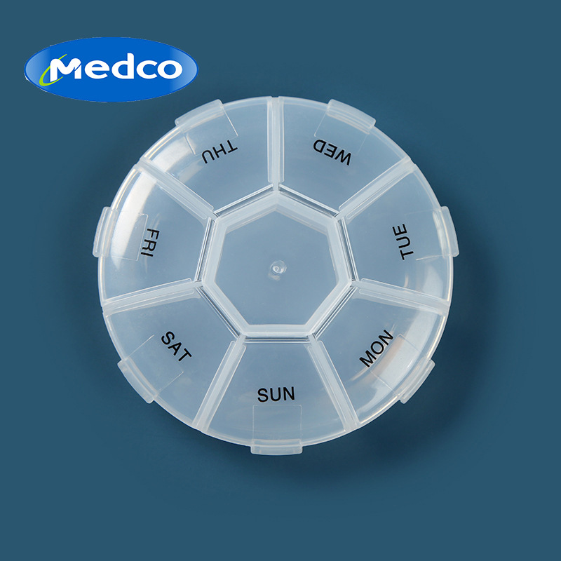 Foreign trade exclusive round seven-compartment pill box, one-week medicine box, English portable plastic press-type capsule box