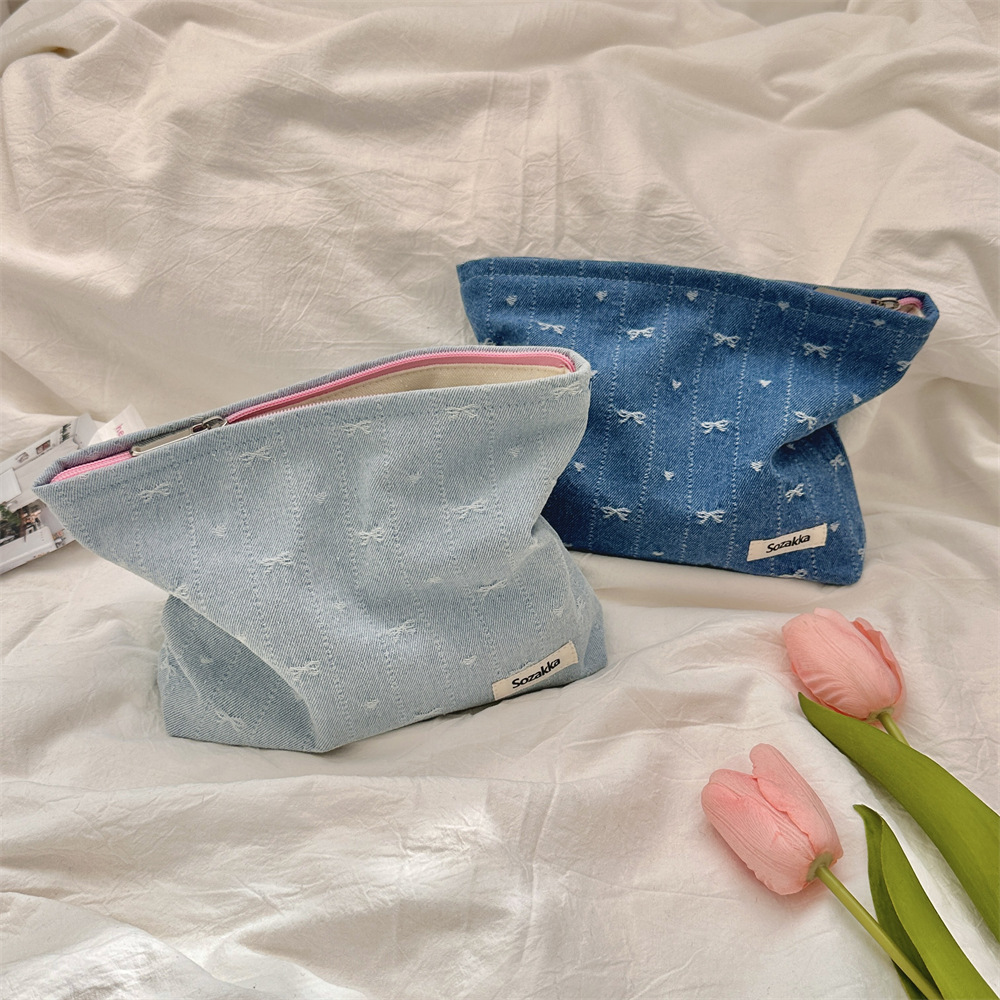410125 牛仔蝴蝶结化妆包水乳护肤品大容量拉链收纳袋逛街手拿包