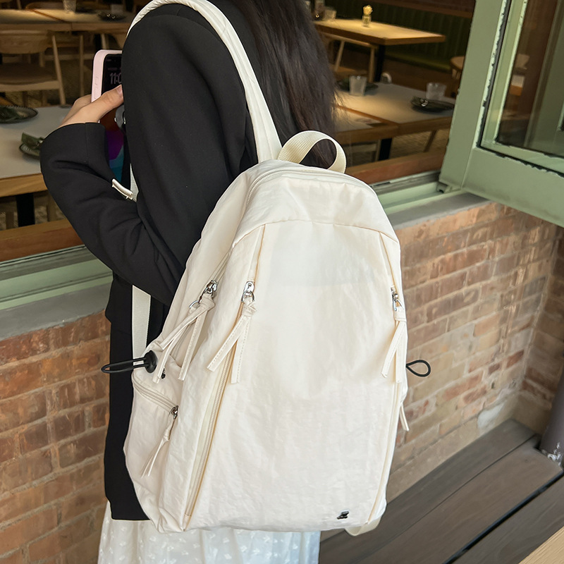 Female lightweight backpack for junior and senior high school students, Japanese-style casual schoolbag. Female college students, simple solid-color backpack. Female school style Specification image