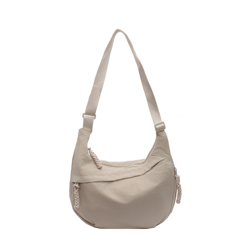 日系简约大容量斜挎包女2024新款学生小挎包单肩布包百搭饺子包女