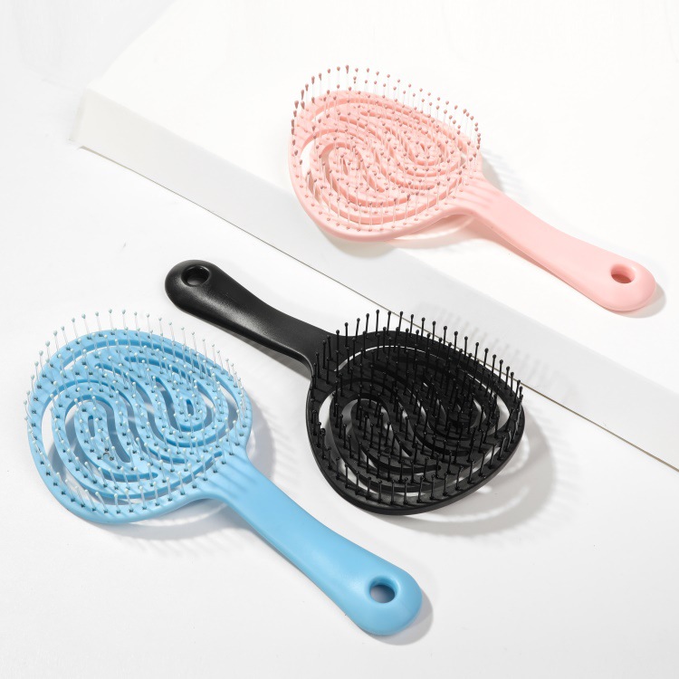 A popular lollipop round hollowed-out comb and colorful plastic massage comb in foreign trade