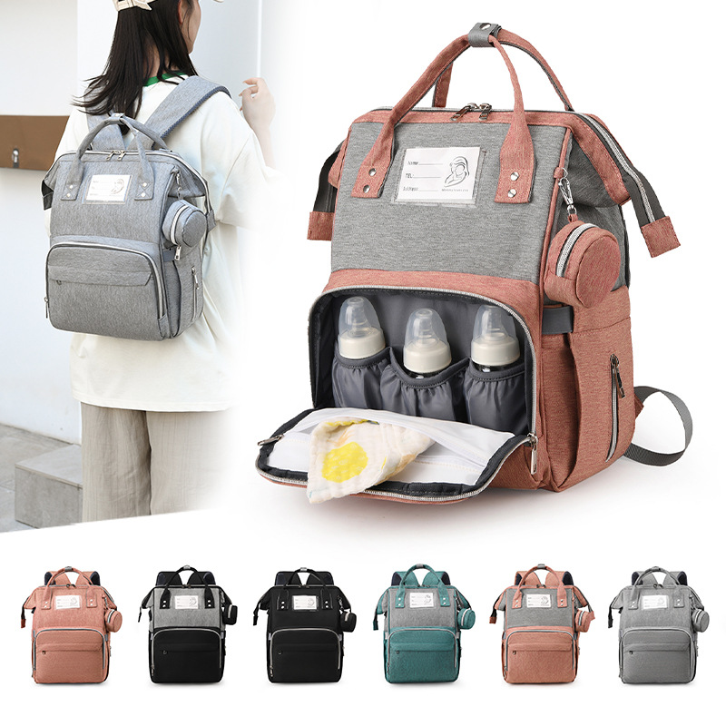 Conjunto de tres piezas mommy bag nuevo estilo de gran capacidad de dos hombros portátil bolsa de madre y bebé almohadilla impermeable septal separación seca y húmeda bolsa de espera de parto Specification image