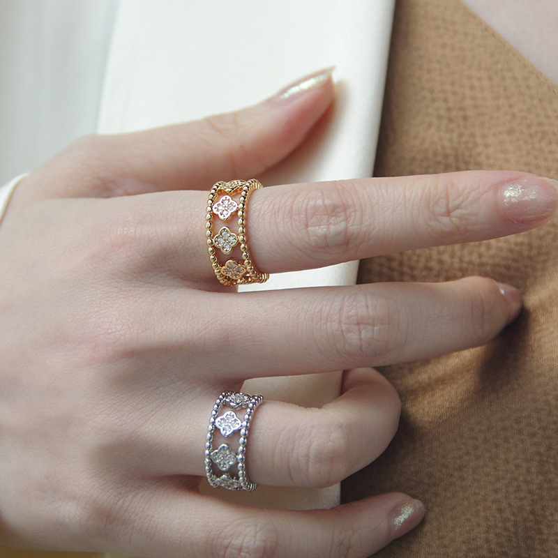 The New Kimoj Ring Exudes A Cross-Border Charm Of European And American Light Luxury. It Is A Zircon Inlaid And Hollowed-Out Four-Leaf Clover Ring For Women, A Niche Accessory That Is Very Eye-Catching
