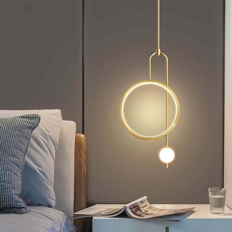 The bedside chandelier in the bedroom is a modern and simple Nordic light luxury living room background wall. It is a creative bedside lamp designed by a popular designer