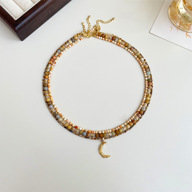 This is a new retro small-sized amine natural stone moon pendant beaded necklace that is versatile for women and can be layered for a high-end look Application Scenario