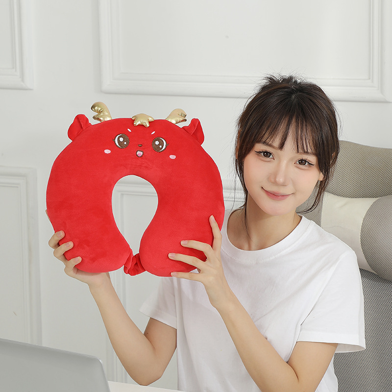 New cartoon-shaped U-shaped pillow for the Year of the Dragon, a two-in-one neck pillow, a transformable throw pillow, and a dual-purpose pillow gift for the Year of the Dragon Application Scenario