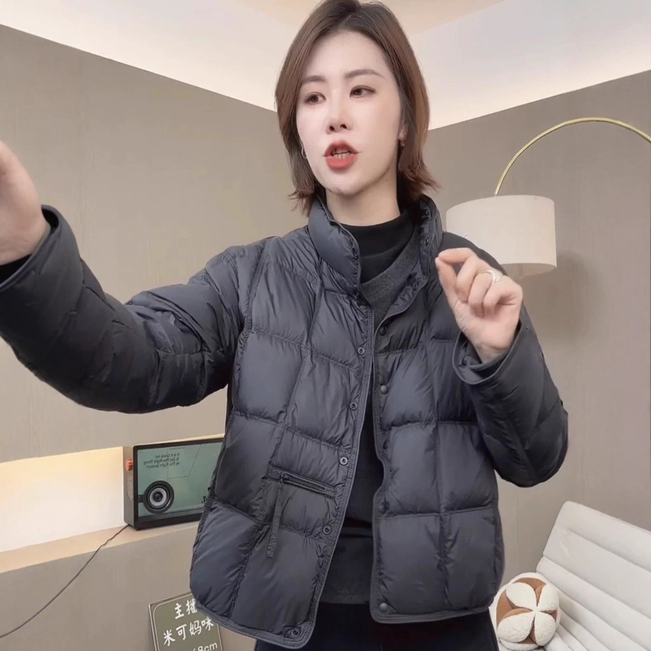The new winter down jacket for women in 2025 features a short stand-up collar, thickened and warm white duck down bread coat in a simple style Application Scenario