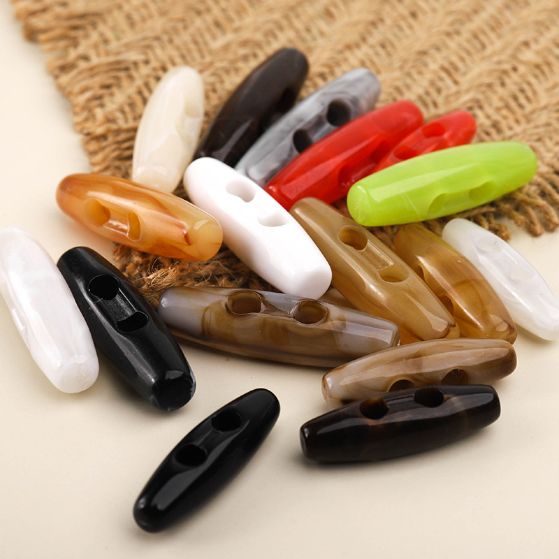 Xinpeng Factory directly supplies acrylic horn buttons for children's sweaters, coat buttons, oval-shaped packaging gift boxes, home textile olive buttons Specification image