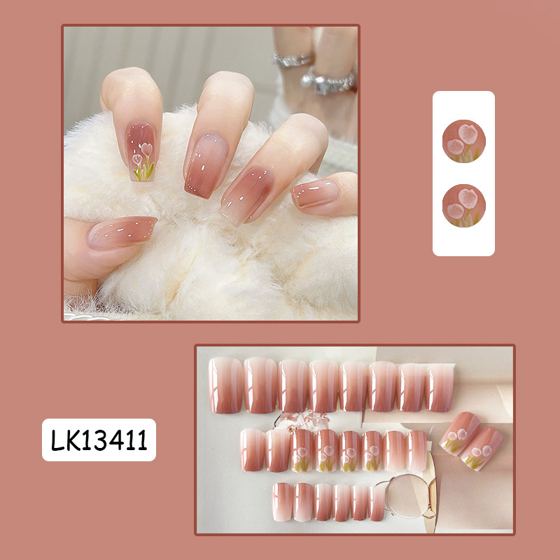 Woman applying nail patch effortlessly on train