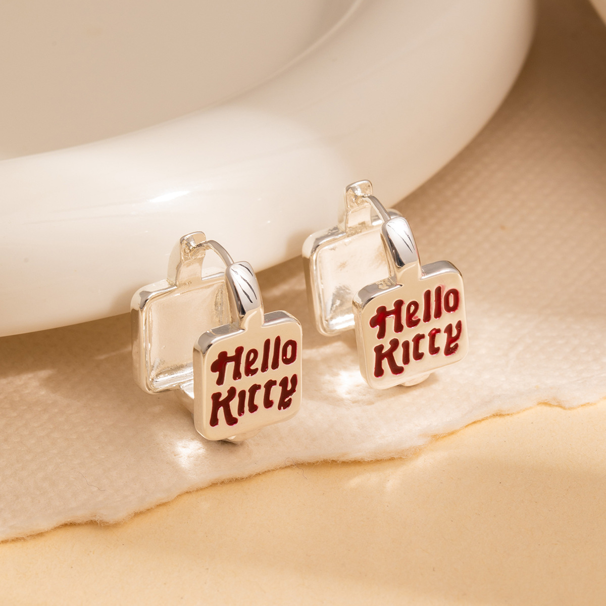 The sweet and cool style KT cat letter square ear buckles from Dongdaemun, South Korea, can be worn on both sides. They are versatile earrings that are sweet and girlish Application Scenario