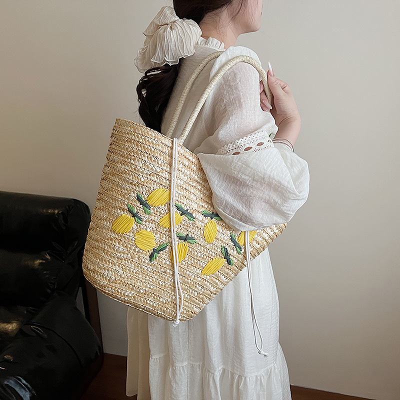 2025 New straw woven bag for women, versatile shoulder bag, high-end commuting tote bag, lemon embroidery woven bag details Picture