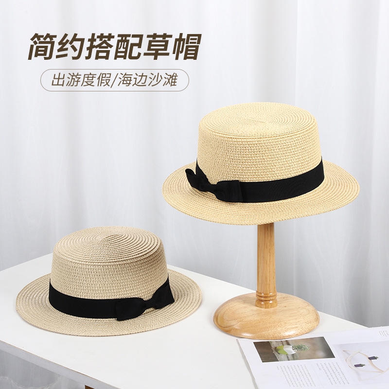 Summer sun protection women's flat top hat, knitted flat brim bow beach hat, outdoor breathable and sunshade straw hat wholesale details Picture