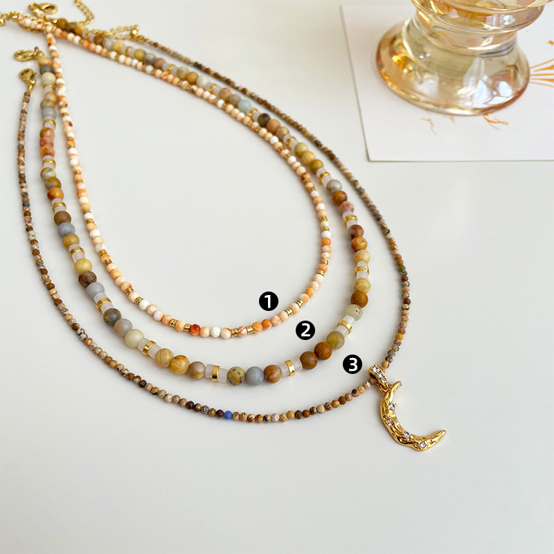 This is a new retro small-sized amine natural stone moon pendant beaded necklace that is versatile for women and can be layered for a high-end look details Picture