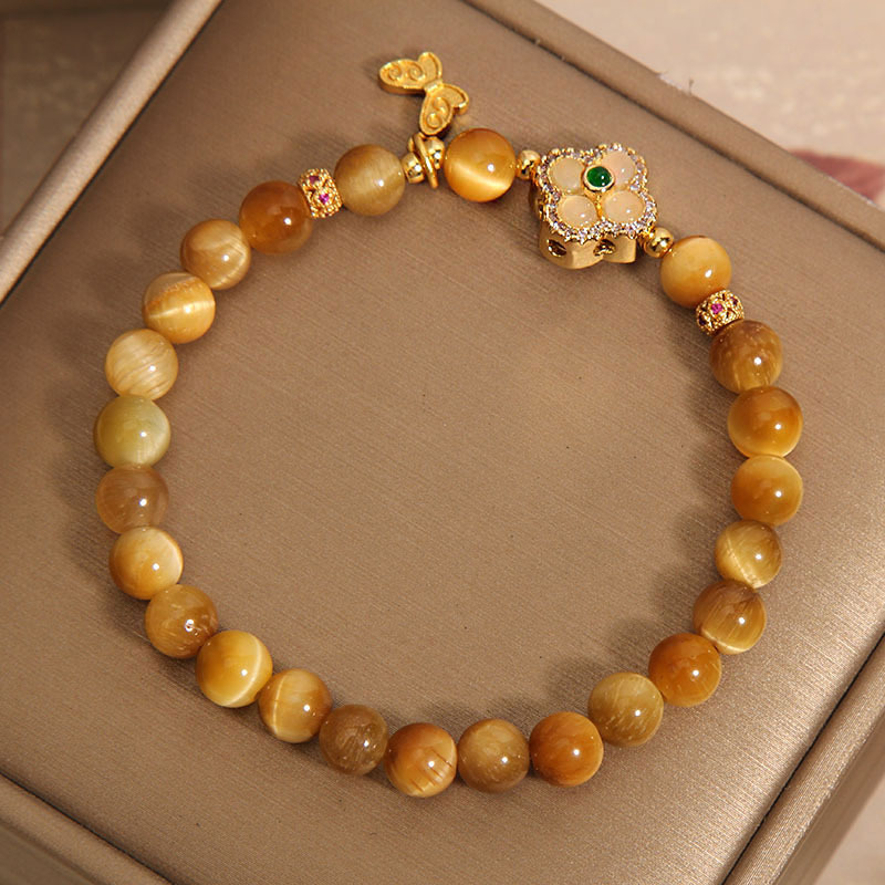 The Golden Tiger's Eye stone bracelet is a new Chinese-style light luxury, niche and exquisite retro four-leaf clover bracelet. It's a gift for your girlfriend and best friend Item Picture