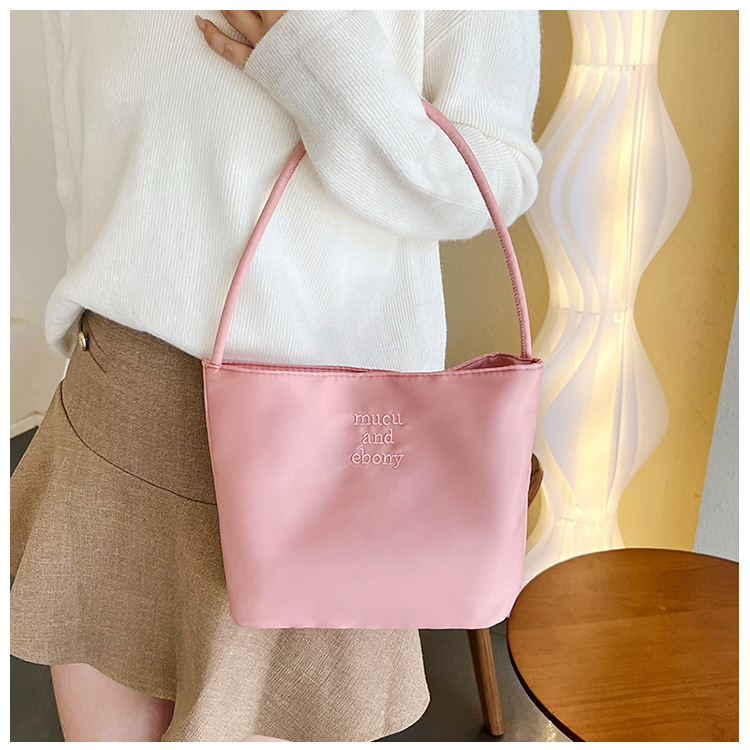 This is a rare and high-end mucu and ebony fashion embroidered nylon versatile underarm single-shoulder handbag for women details Picture