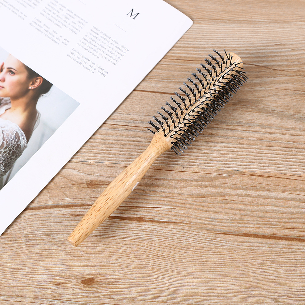 Factory direct sales of curly hair combs, wooden color, inner buckle design, round anti-static wooden comb details Picture