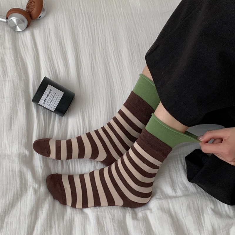 One-piece consignment of socks from the street stall 2026 dopamine color-blocking striped double-layer socks with rolled-up cuffs and piles of spring and autumn Japanese-style mid-calf women's sports socks Application Scenario
