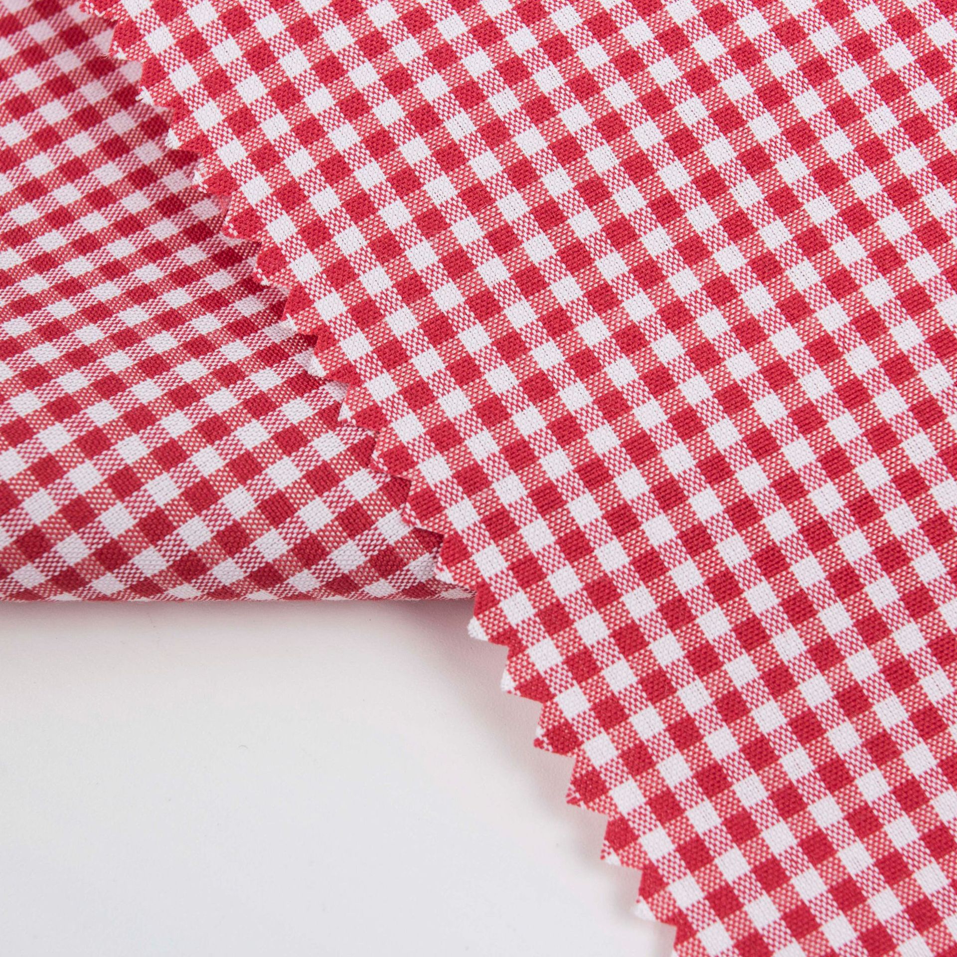 现货厂家批发TC涤棉平纹色织格子面料春夏衬衫连衣裙子格子布白底实物图