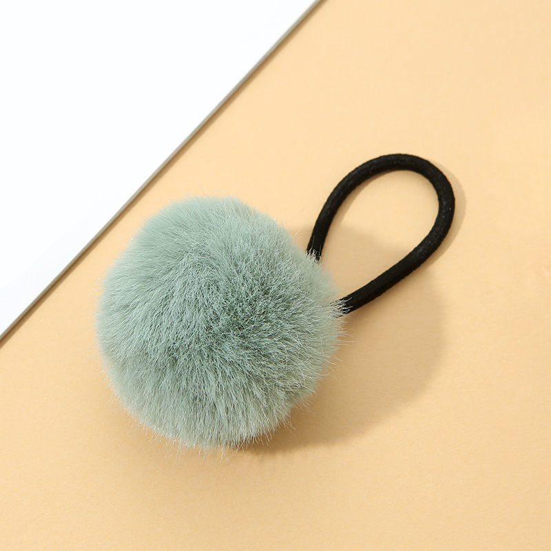 The cute and colorful plush hair tie for autumn and winter is super soft. The fluffy pom-pom hair band won't hurt the hair. Girls tie their hair with leather bands Specification image