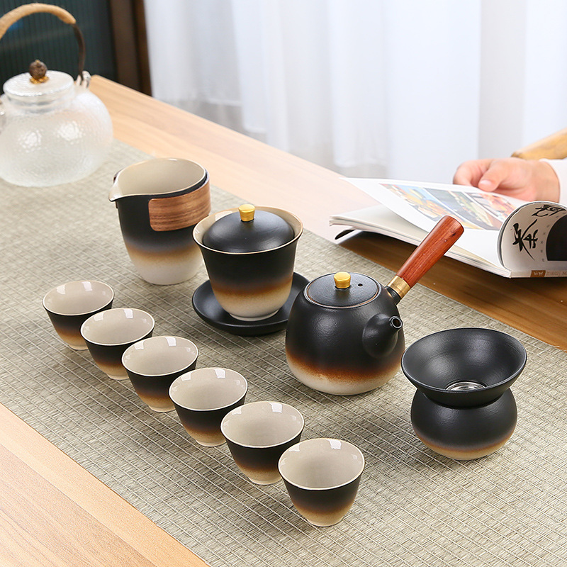 A complete set of Japanese coarse earthenware Lu Bao Kung Fu tea sets, black earthenware tea cups, covered bowls, side-handled teapots, and creative logos for both home and commercial use