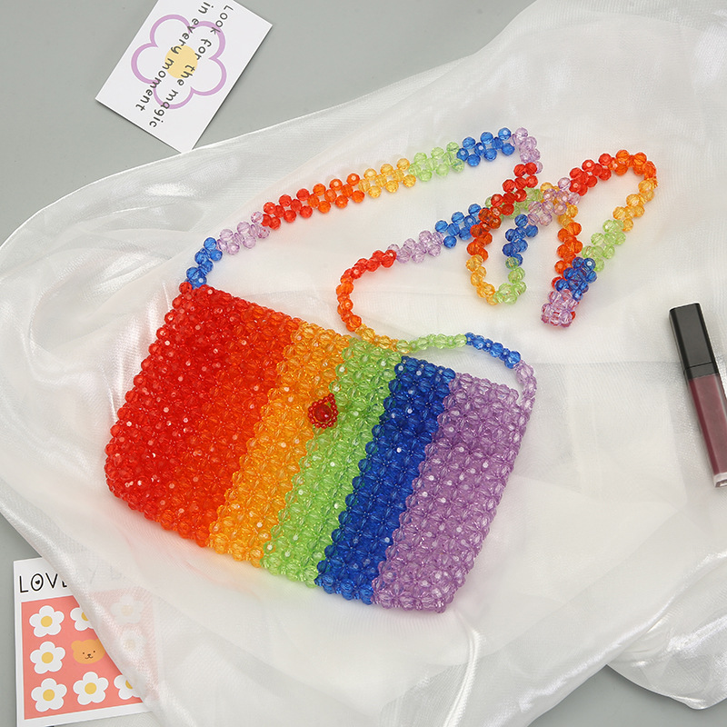 Creative color-blocking hand-held pearl bag, Japanese and Korean internet-famous hand-woven bag, pearl woven handbag, elegant decorative storage bag, and other hair accessories details Picture