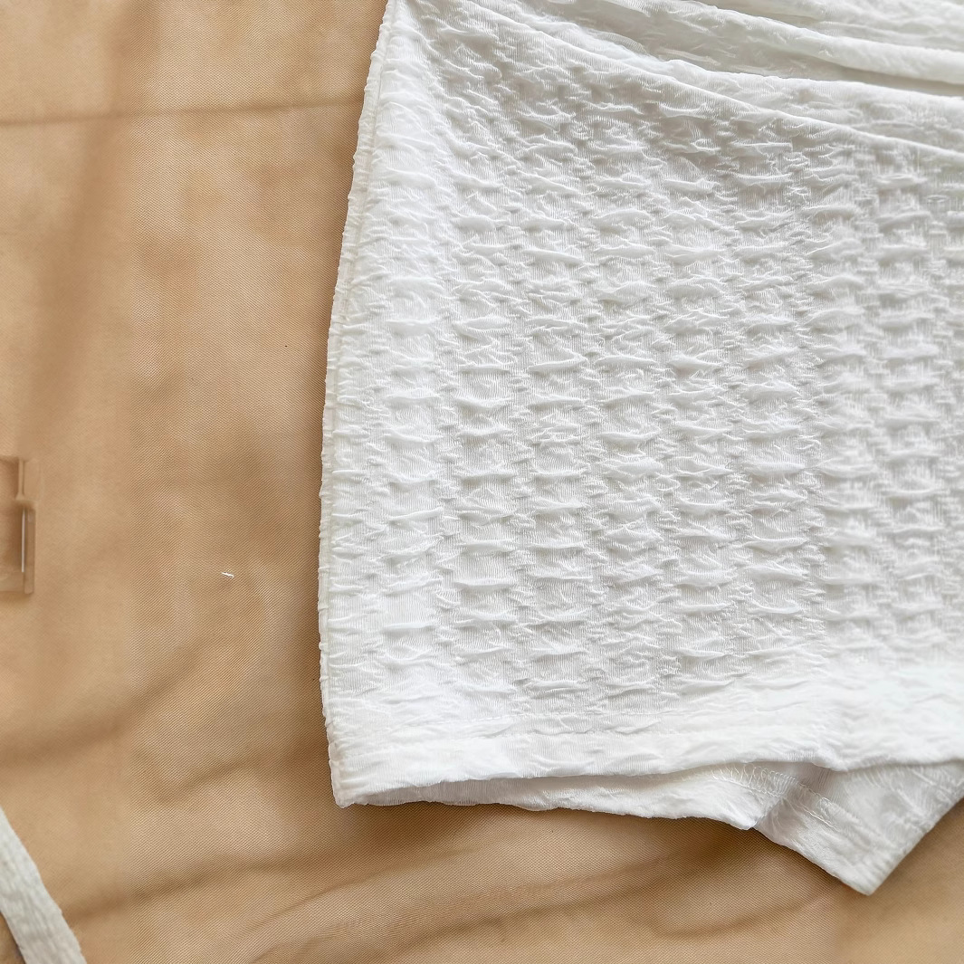 In 2025, a cross-border bestseller in Europe and America, the white women's vacation white knitted texture metallic texture slimming jumpsuit Item Picture