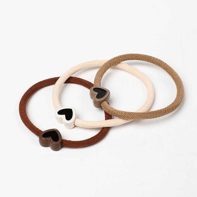 A new, stylish and simple hair band in milk coffee color, a heart-shaped Korean hair accessory that won't damage hair, a hair tie, a ponytail, and a leather band for women Item Picture