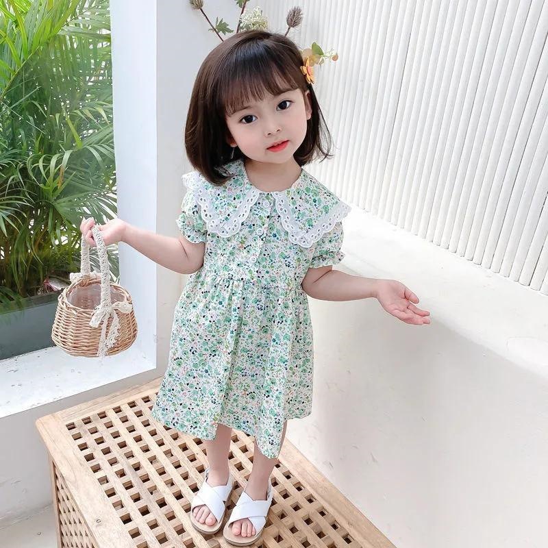 A new Korean version of a girl's floral print dress with a baby collar, a short-sleeved children's princess dress