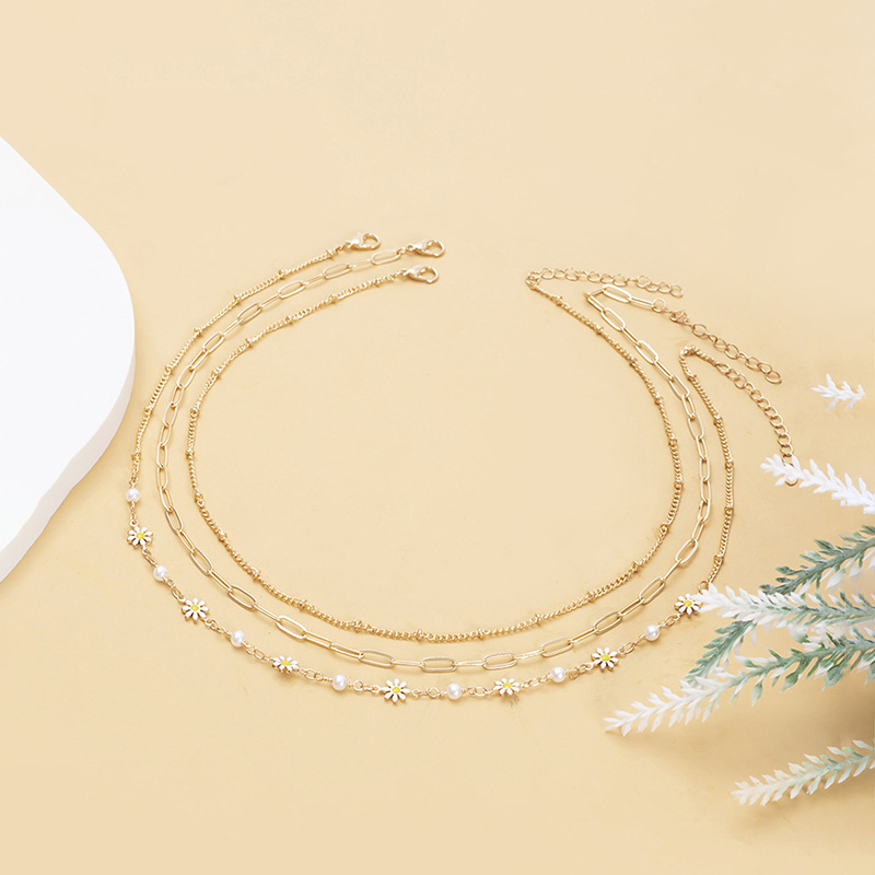 Design sense small Daisy pearl necklace female INS wind light luxury small fold wear clavicle chain anklet set tidal wholesale Specification drawing
