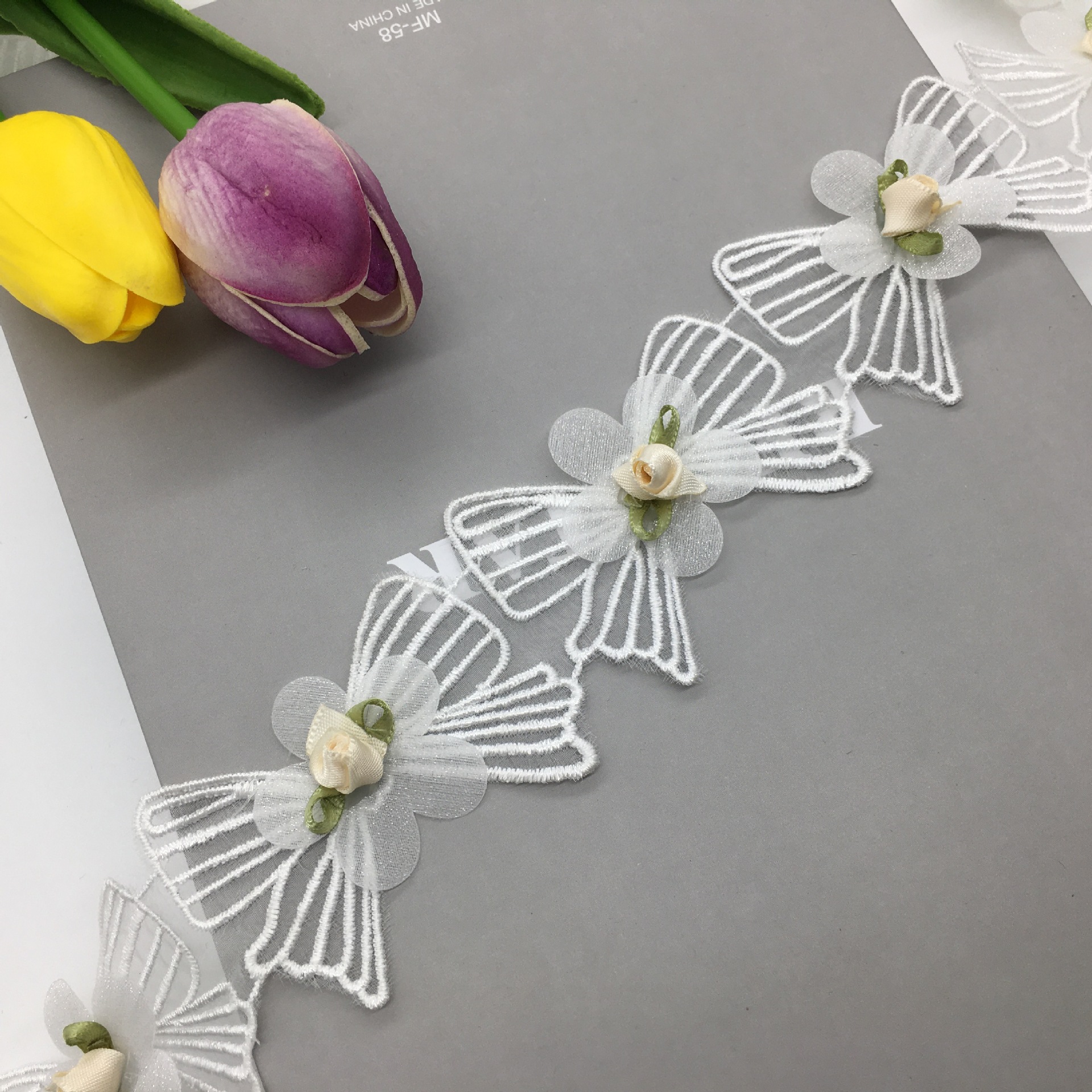 服饰窗帘蕾丝/蝴蝶结刺绣贴/手工钉珠花边细节图