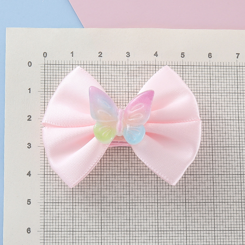 Wholesale of new children's pink bow Ins-style colorful butterfly resin cute and fashionable hair clip accessories Application Scenario