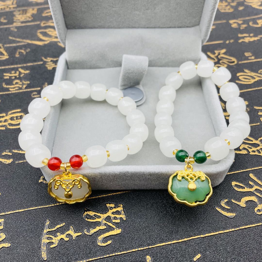 The new imitation white jade bracelet, inlaid with gold and white jade auspicious cloud lock bag accessory, is a fashionable and elegant men's and women's bracelet for live streaming details Picture