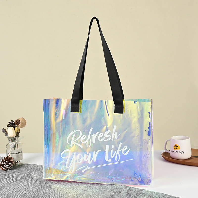 Customized pvc laser bags, transparent creative handbags, wholesale of popular jelly bags, and colorful laser clothing bags full figure