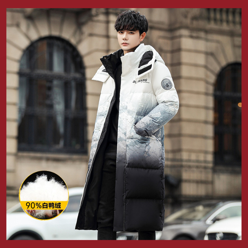 A new winter trend of light and thin down jackets for both men and women. A long, knee-length, large-sized 90 white duck down hooded jacket