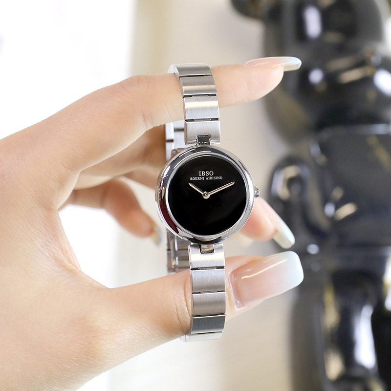The white moonlight round small silver watch at the counter, a stylish women's watch with a thin strap, is light luxury and has a high appearance level. It features a niche and simple style in 2025 details Picture