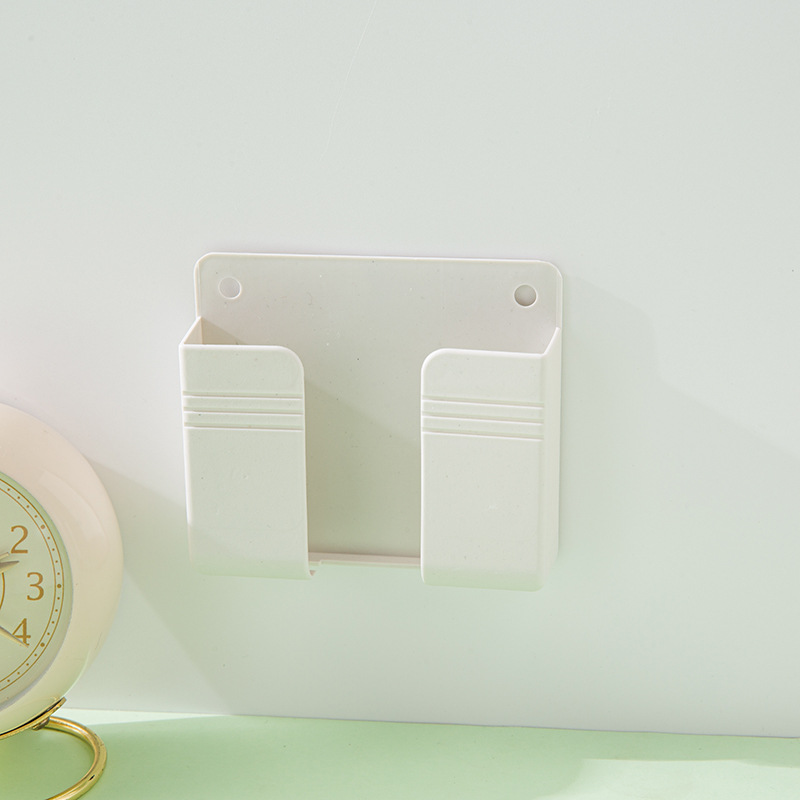 Wholesale of wall-mounted mobile phone charging box stand, remote control base without drilling, wall-mounted storage rack base Application Scenario