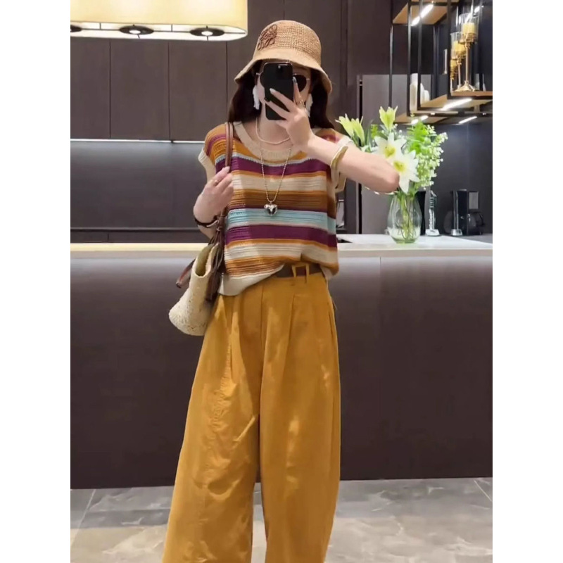 A youthful and fashionable Hong Kong-style set for women's summer, featuring a new hollowed-out color-blocking striped knitted sweater and two-piece 9-inch casual pants full figure