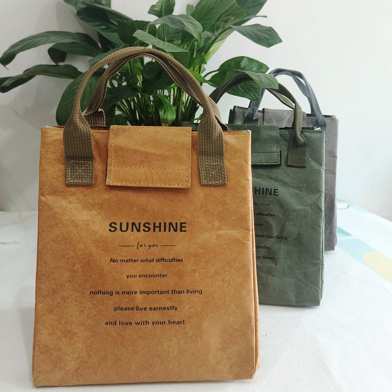 The hand-held kraft paper insulated bag can be used as a DuPont paper picnic bento bag, a washable lunch bag that won't break, and a meal bag for work Item Picture