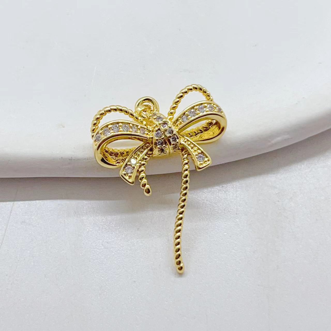 A new copper-plated real gold, slightly inlaid zircon, light luxury, individual, fashionable and versatile inS-style bow pendant details Picture