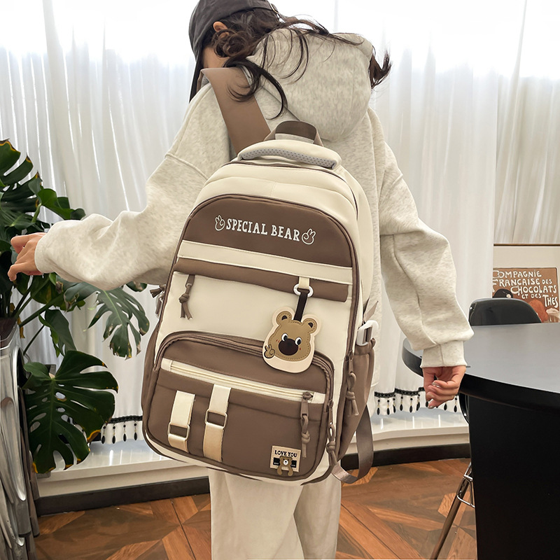 批发新款初高中学生大容量书包轻便减负背包小学生简约结实双肩包细节图