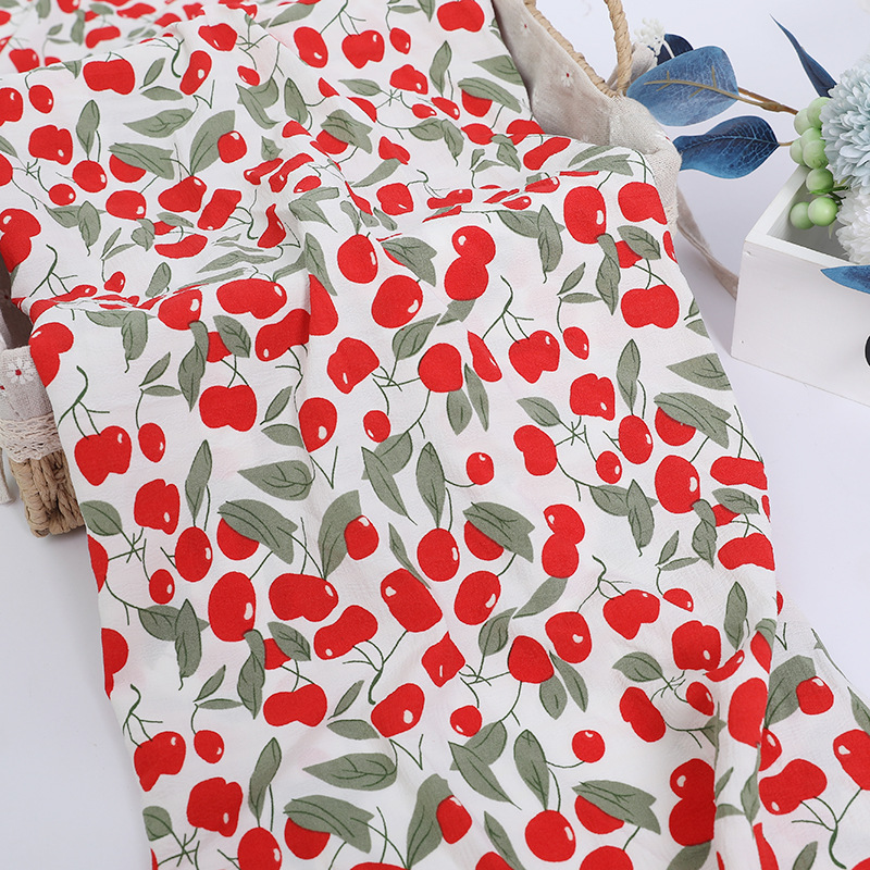 Wholesale of children's clothing and accessories fabric with polyester aurea, polyester bubble pattern, white base and small cherry chiffon printing Specification image