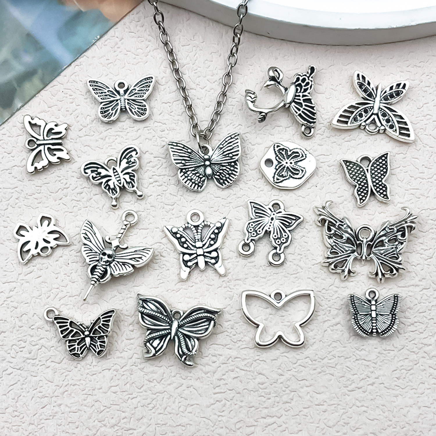 Ancient silver alloy animal series simulation hollowed-out butterfly pendant, diy jewelry accessory, cross-border Amazon Application Scenario