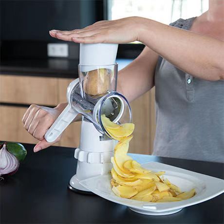 The new multi-functional hand-cranked vegetable slicer is a versatile tool that can be used to cut vegetables into shreds, slices and strips