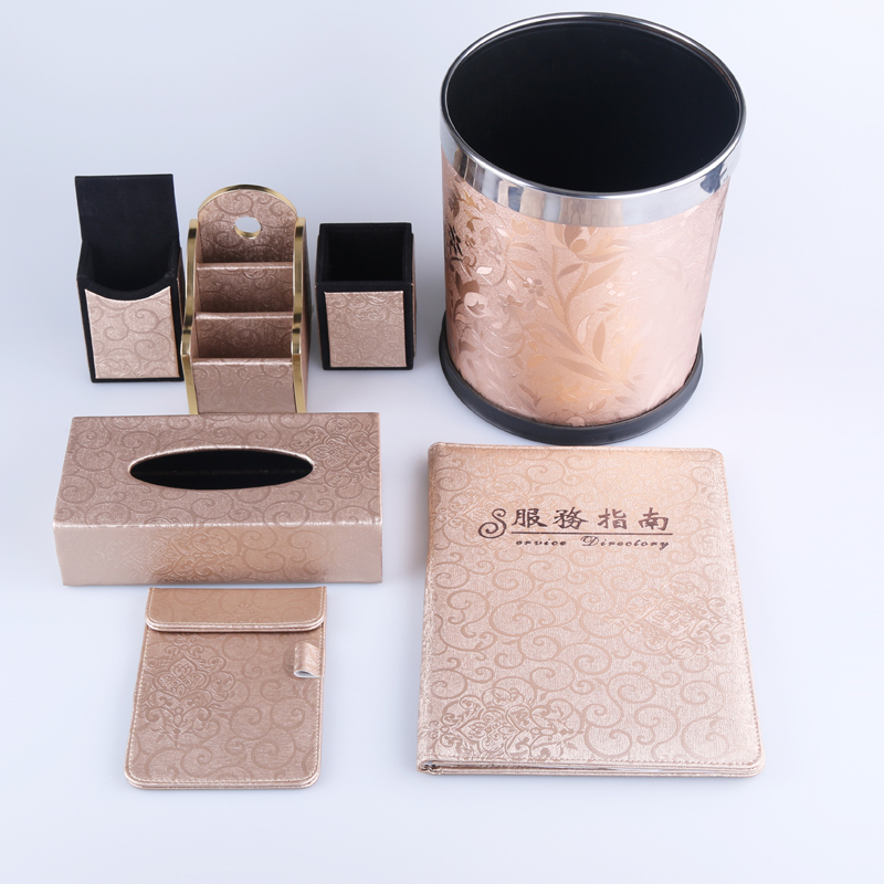 Hotel supplies, hotel room trash cans, service guide, sticky notes, remote control boxes