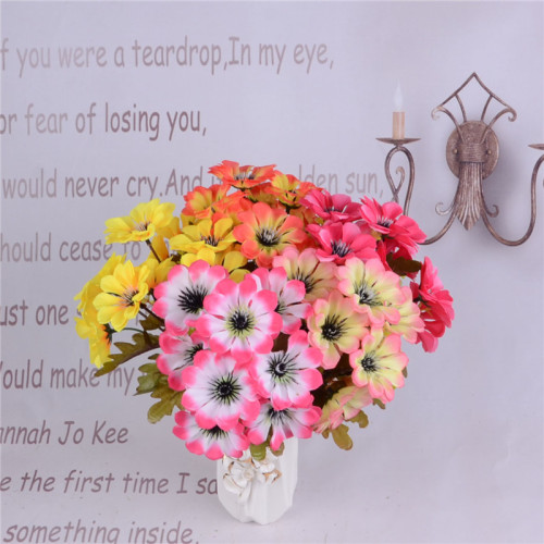 Five artificial flowers of autumn color, round chrysanthemums