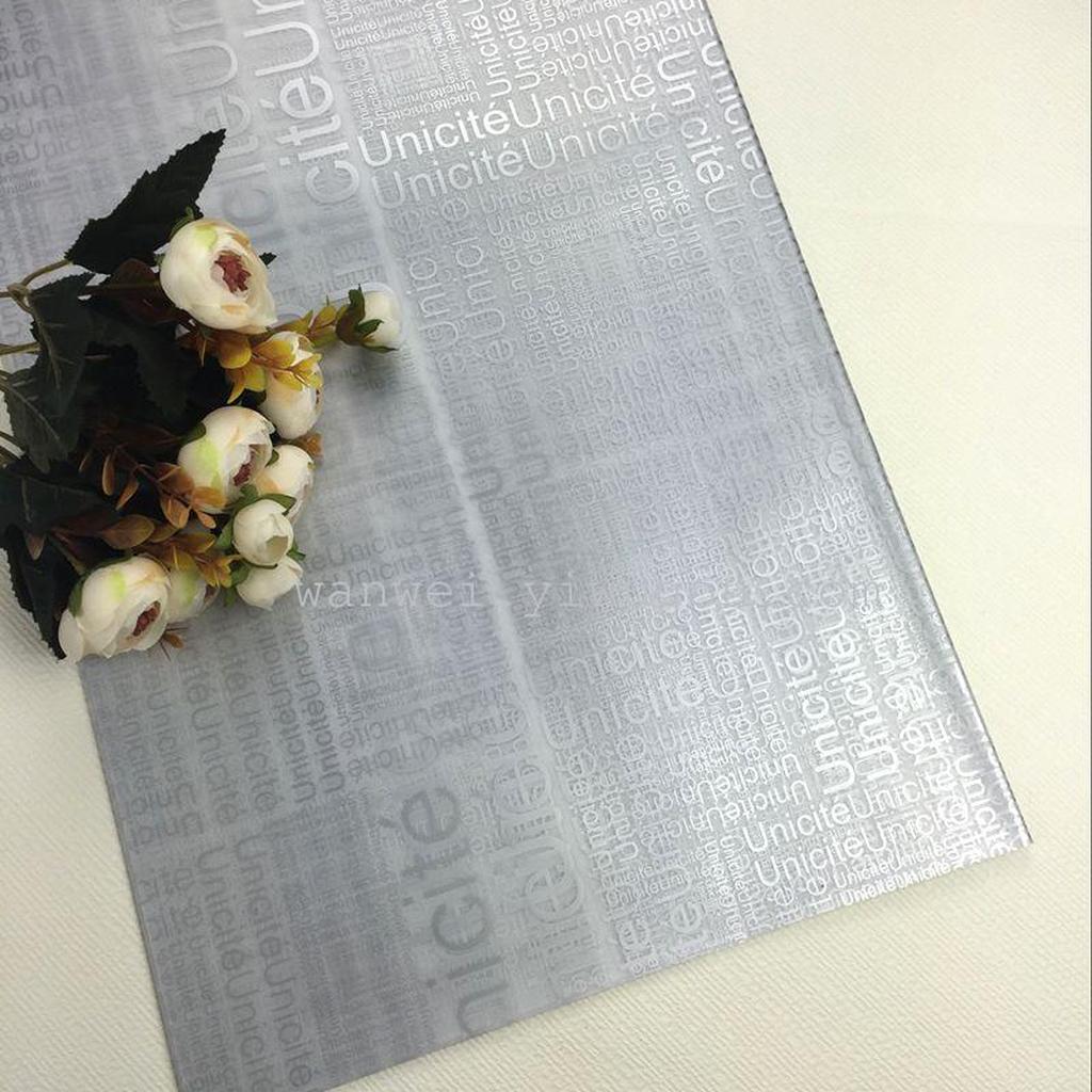 Yiwu City packaging materials printed with English characters, matte paper, flower packaging materials details Picture