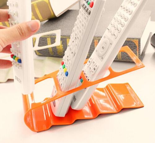 Korean version creative four-compartment remote control storage rack, plastic desktop storage rack and storage seat
