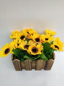 Imitation wooden bales and sunflowers adorn Windows and living rooms